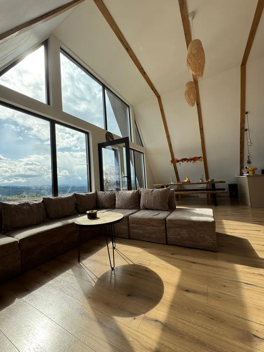 Sofa and sunlit wooden floor in the living room
